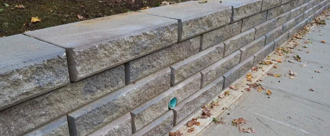 Retaining wall used to add extra seating to a patio in Scarsdale, NY
