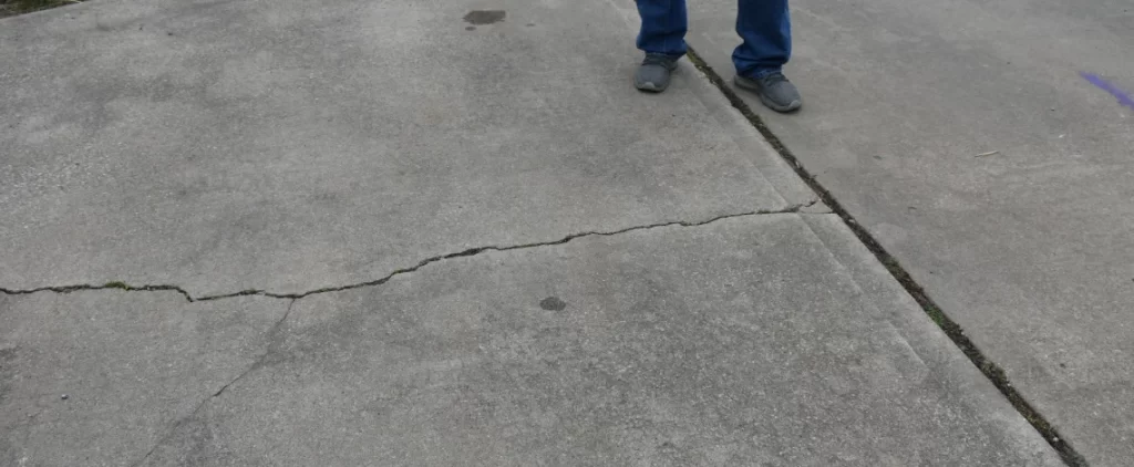 why do driveways crack
