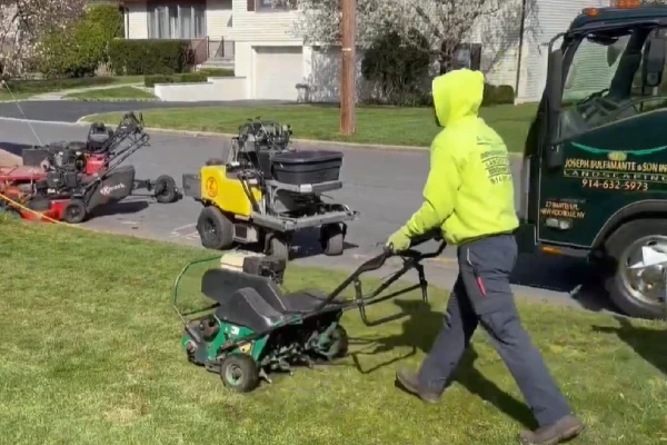 Core lawn aeration service relieving soil compaction for healthier grass roots